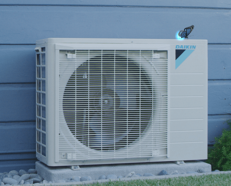 Daikin FIT outdoor unit installed alongside a home
