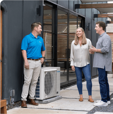 A Swiss Air comfort advisor walking homeowners through an outdoor unit